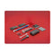Automotive and motorcycle mechanic hand tools, gloves, and tuning equipment on red background