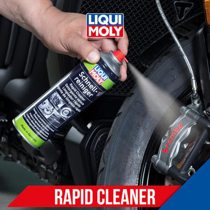 Person using LIQUI MOLY rapid cleaner on a car part with the brand logo displayed.
