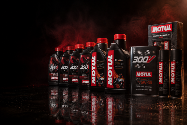 Collection of Motul oil bottles and packaging on a dark background