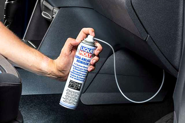 Liqui Moly A/C System Cleaner being sprayed into a car air-conditioning system