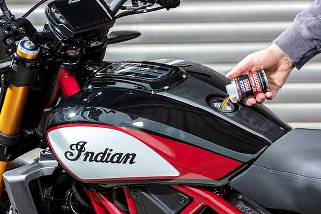 Liqui Moly Motorbike 4T Shooter being poured into a motorcycle fuel tank