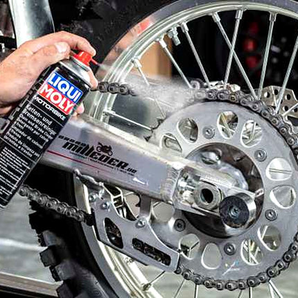 Liqui Moly Motorbike Chain and Brake Cleaner being sprayed onto a motorcycle chain