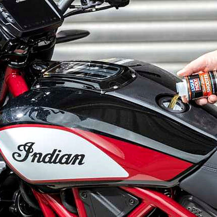 Liqui Moly Motorbike Speed Shooter being poured into a motorcycle fuel tank