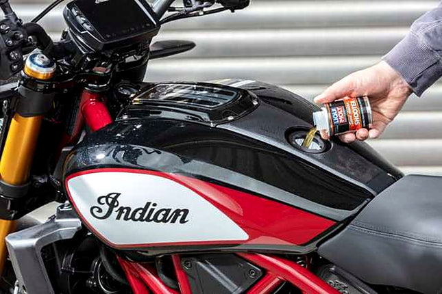 Liqui Moly Motorbike Speed Shooter being poured into a motorcycle fuel tank