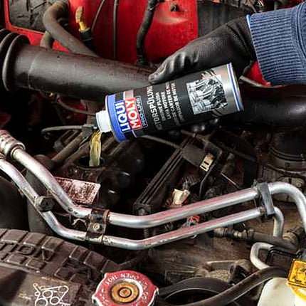 Liqui Moly Pro-Line Engine Flush being poured into a car engine oil filler