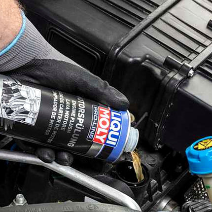 Liqui Moly Pro-Line Engine Flush being poured into an engine oil filler neck
