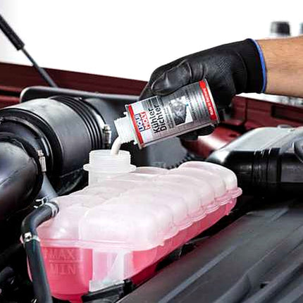 Liqui Moly Radiator Stop Leak being poured into a car coolant expansion tank