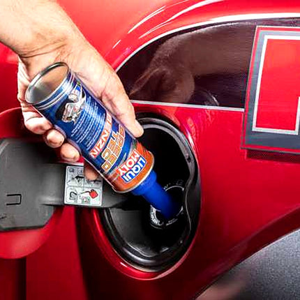 Liqui Moly Speed Tec Gasoline being poured into a car fuel filler