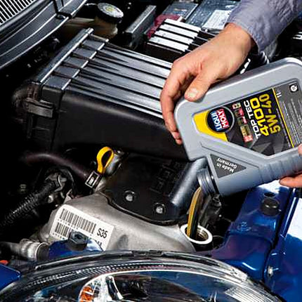 Liqui Moly Top Tec 4100 5W-40 being poured into a car engine