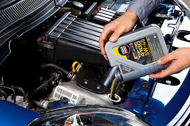 Liqui Moly Top Tec 4100 5W-40 being poured into a car engine