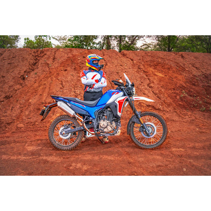 Hero XPulse 210 fitted with the Powerage slip-on exhaust, side view on a trail