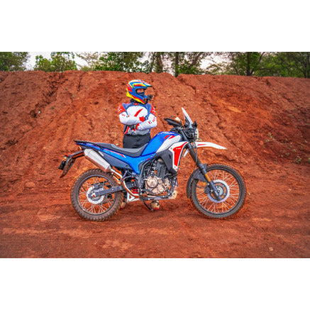 Hero XPulse 210 fitted with the Powerage slip-on exhaust, side view on a trail